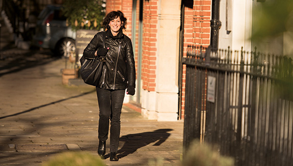 woman-walking-down-city-street-understanding-a-colostomy